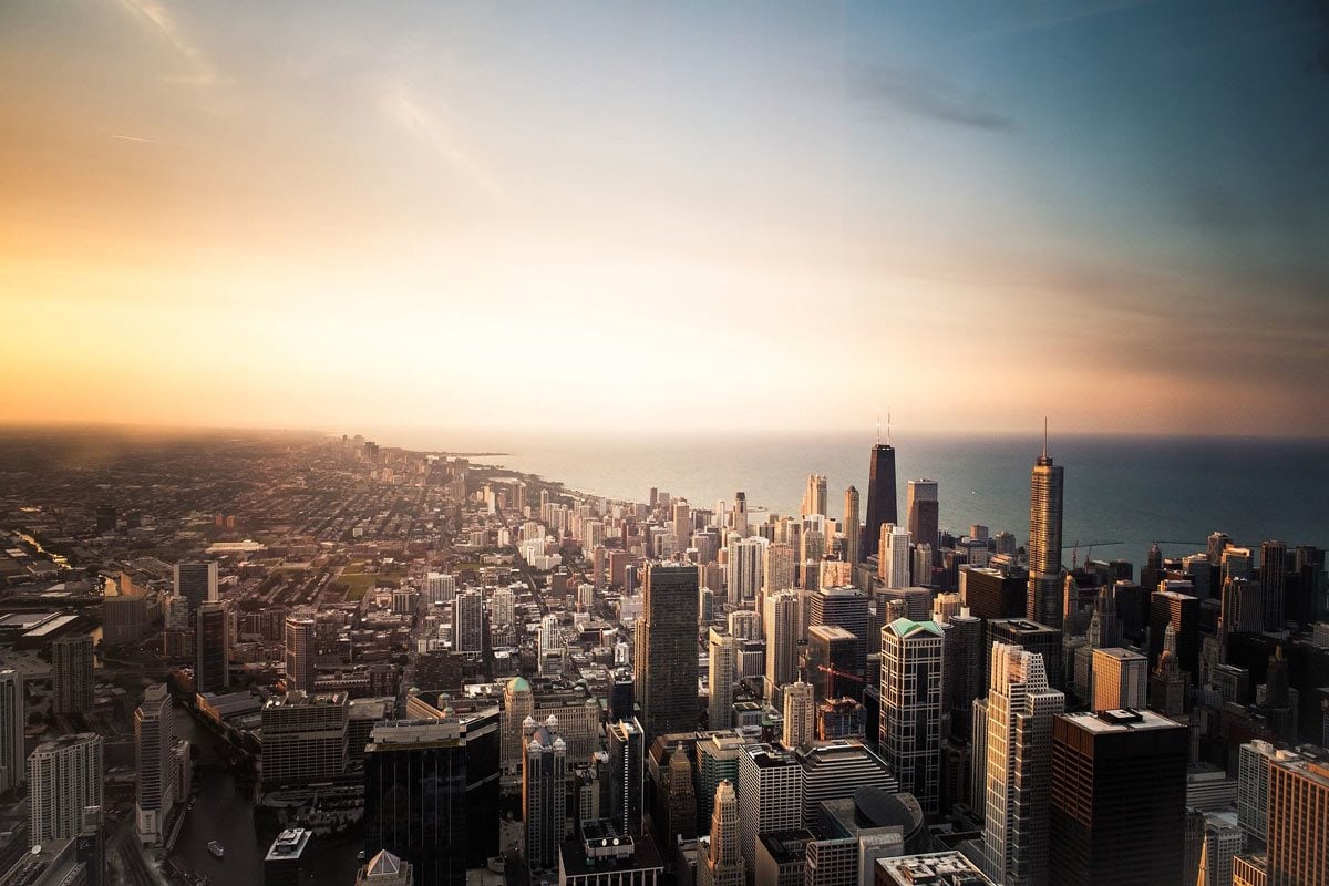 The Chicago skyline lit up by sunset.
