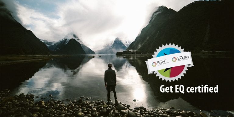 A runner stands beside a stunning mountain lake: "Get EQ Certified"