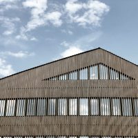 A building on a university campus looking great against the blue sky.