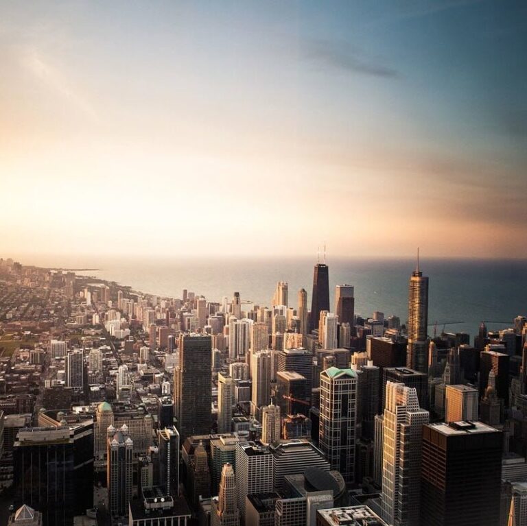 The Chicago skyline lit up by sunset.